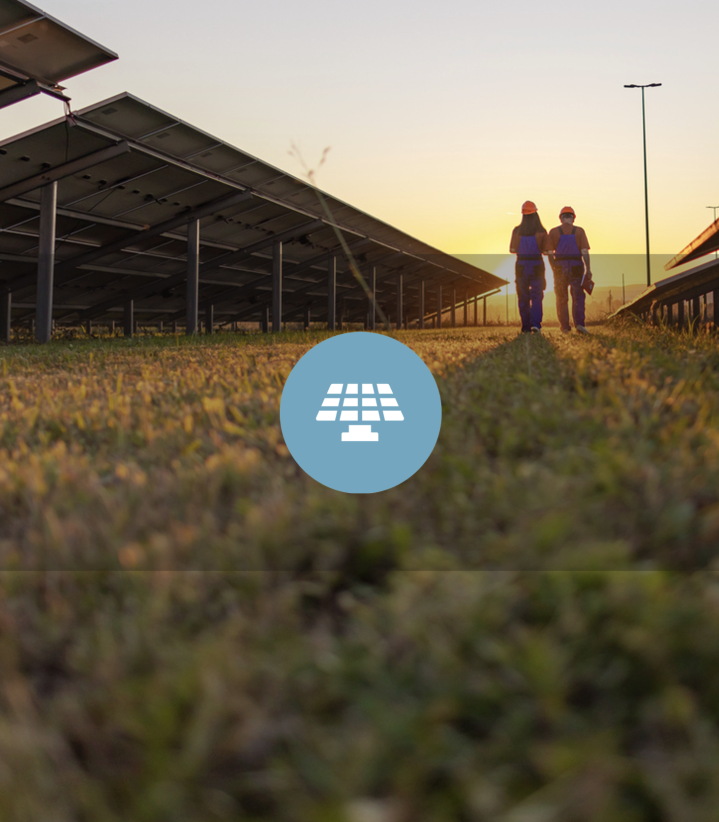 Solar farm with two people and sunset