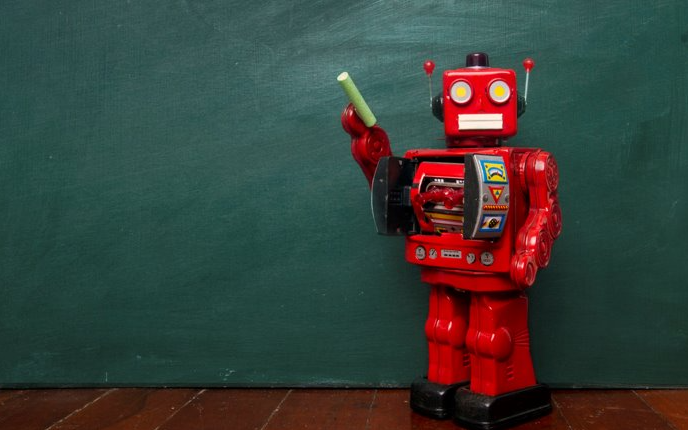 red robot teach pointing to classroom chalkboard with green chalk