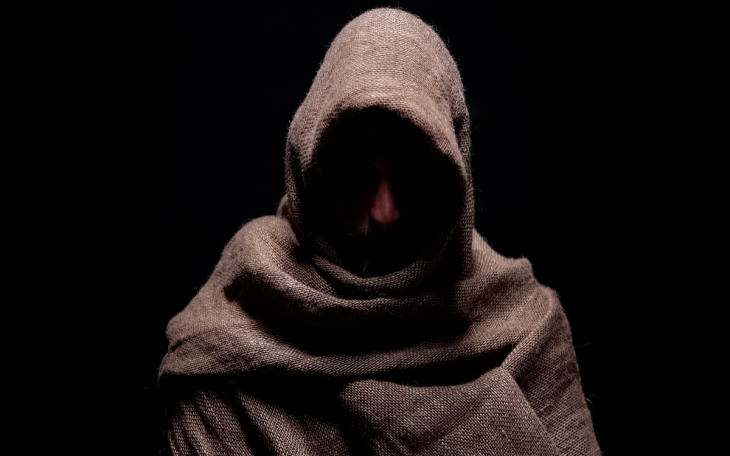 traitor cloak hooded man brown