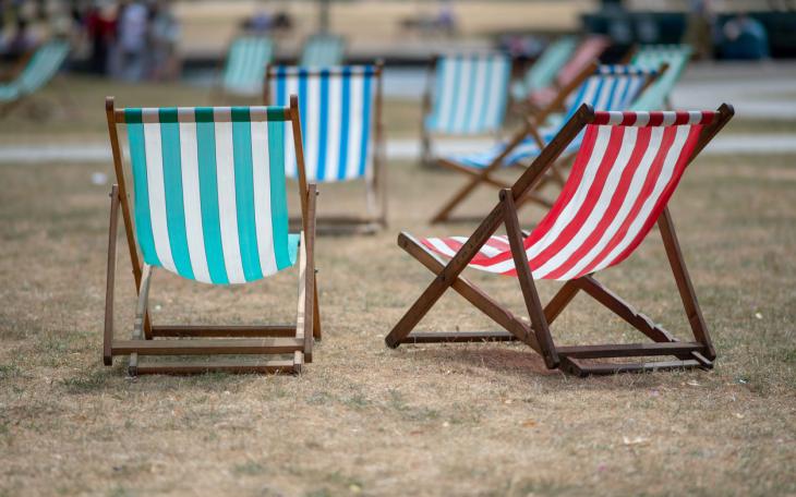 beach chairs on dry grass