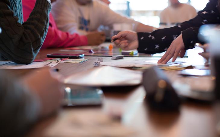 young people playing board games
