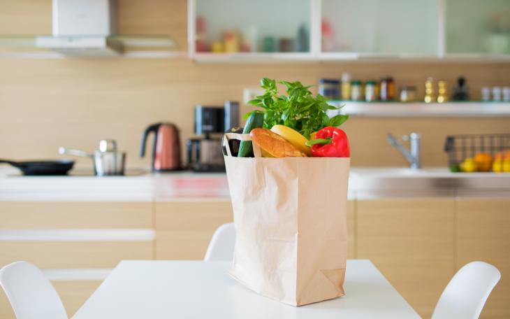 bag of groceries on kitchen table