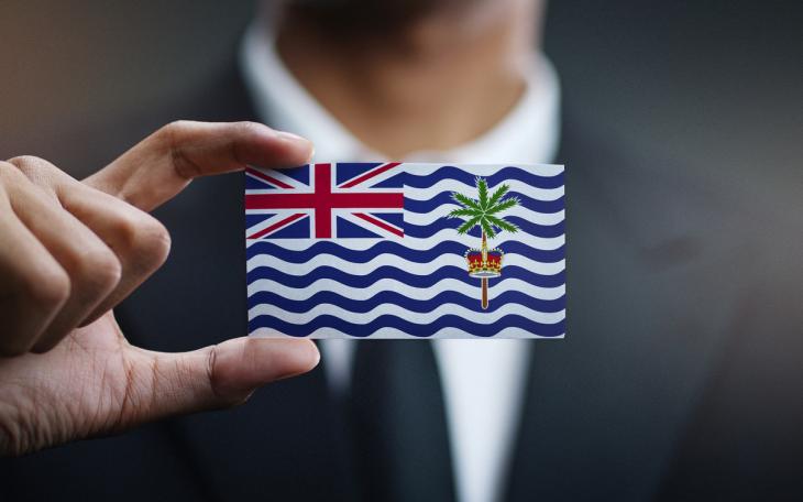 man holding small chagos flag