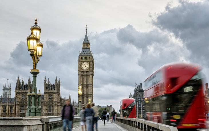 Westminster, red bus and pedestrians