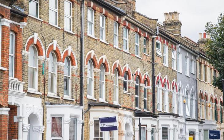 Row of victorian housing with rental boards