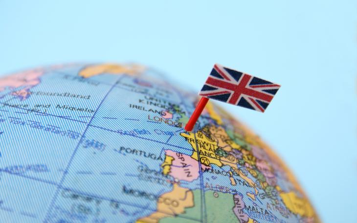 globe with union jack flag pinned on UK