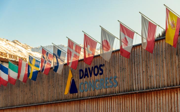 davos congress building with world flags outside 