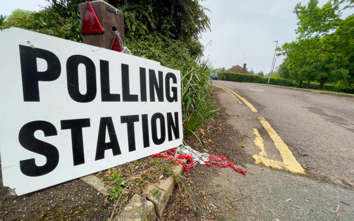 polling station sign on road