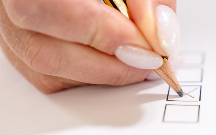 pen writing on ballot box