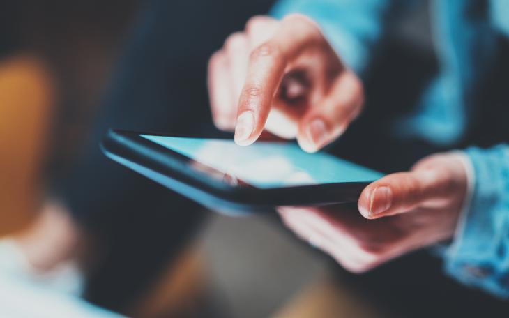 man on phone in blue shirt