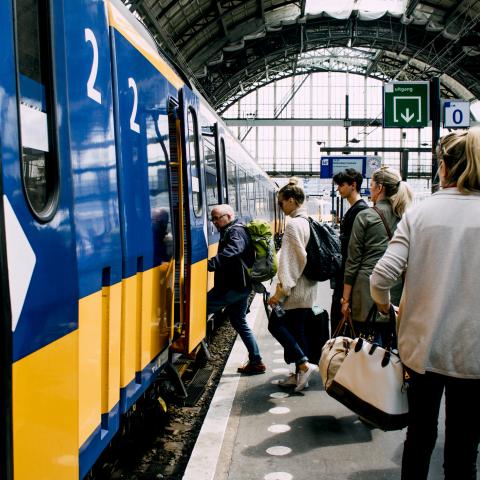 train platform station people boarding train