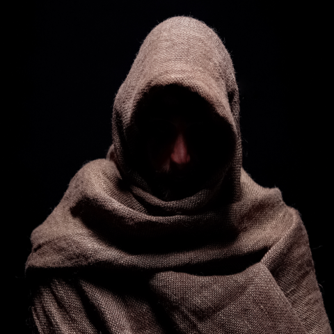 traitor cloak hooded man brown