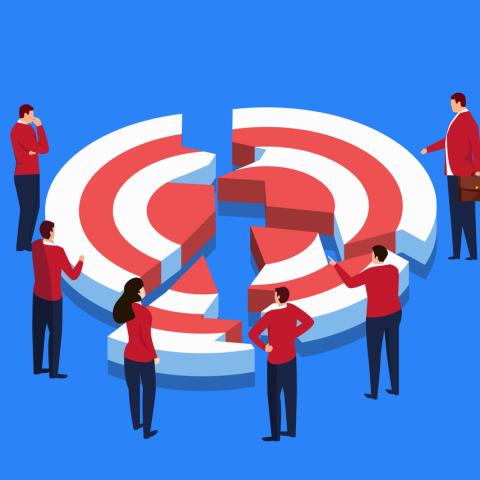 people stood around a broken target bulls eye 