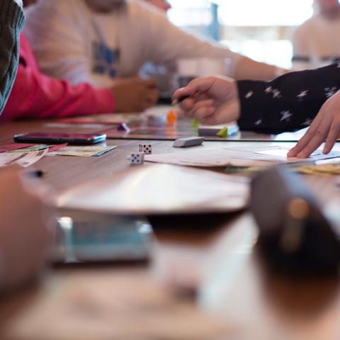 young people playing board games
