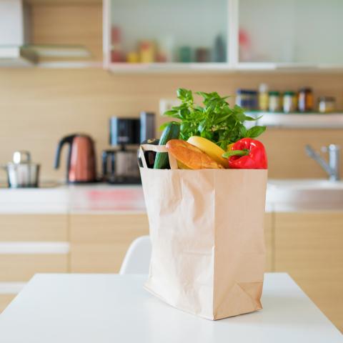 bag of groceries on kitchen table