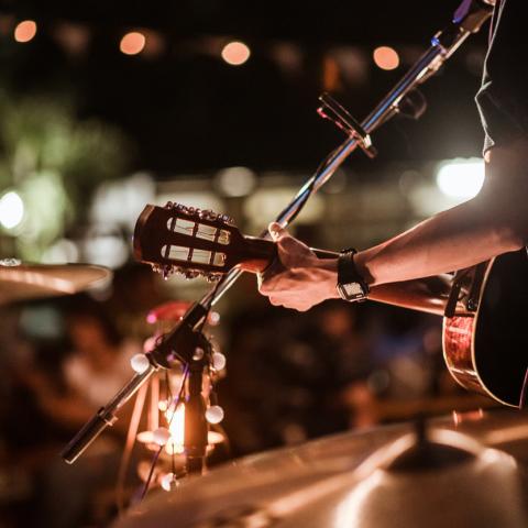 Musician playing in front of crowd