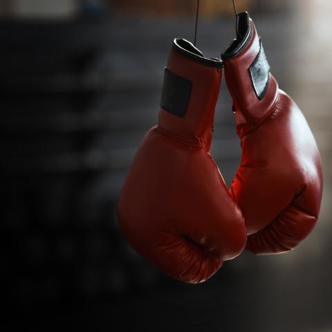 red boxing gloves hanging from the string
