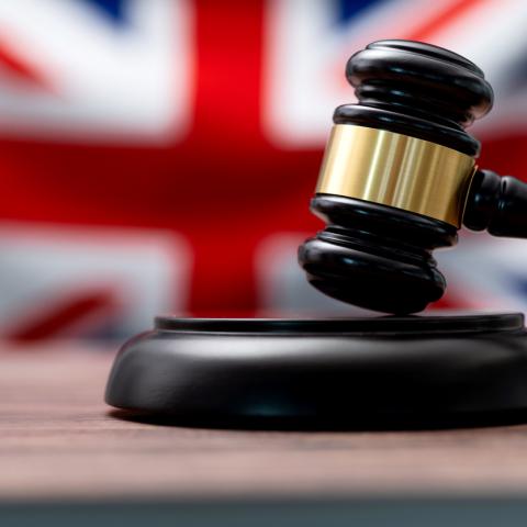 gavel behind British flag