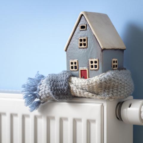 Plastic house on a radiator 