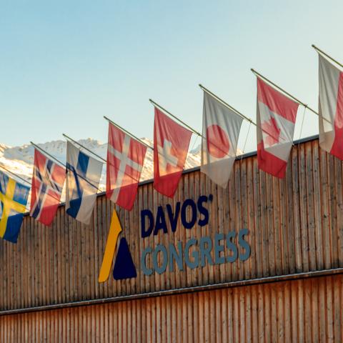davos congress building with world flags outside 