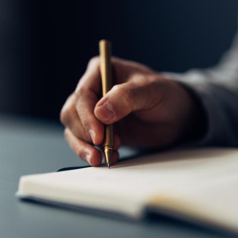 Hand holding pen