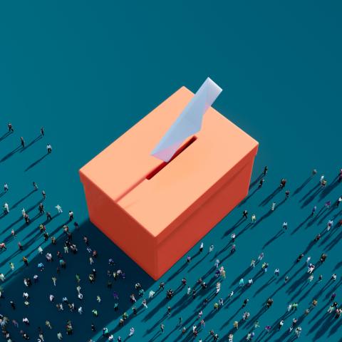 orange ballot box against a green background 