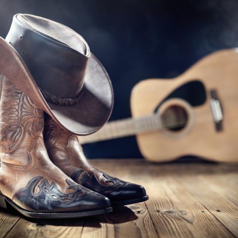 cowboy boots, hat and guitar
