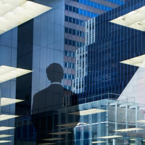 corporate abstract with businessman looking out